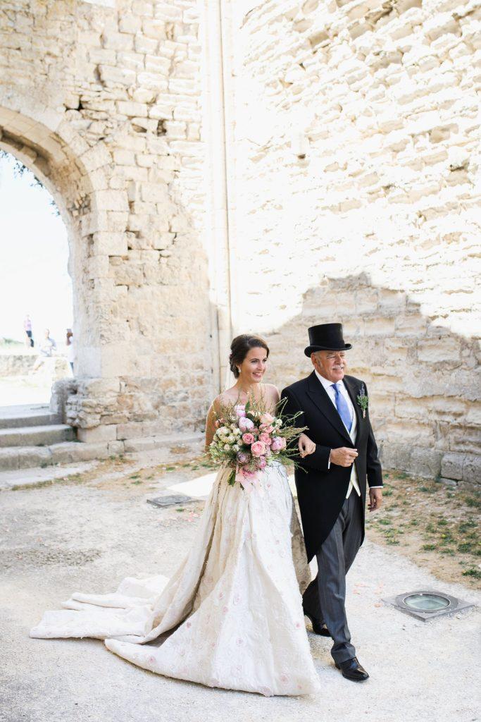 Bride and father of the bride at a luxurious wedding planned in France
